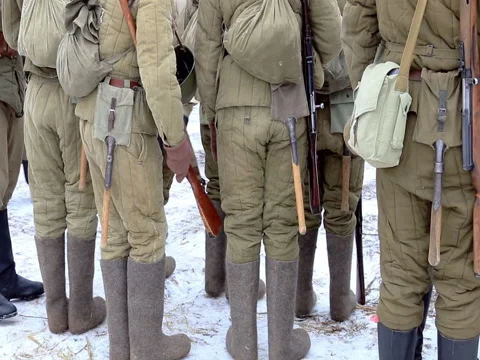 Soldiers in uniform during the second world war stand in the snow. Stock Footage 74008043