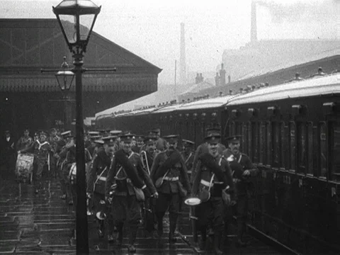 Soldiers walking on train station, getting into wagons with luggage, UK 1909 Stock Footage 136682219