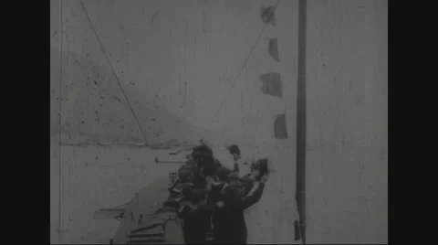 Soldiers waving with their caps on u-boat Stock Footage