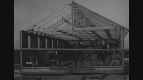 Soldiers working on construction of portable barracks Stock Footage