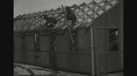 Soldiers working on construction of rooftop Stock Footage