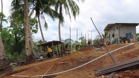 Soldiers working on a small construction site Stock Footage 111233577