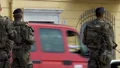 Soldiery patrolling city streets with weapon, safety and public order control HD Footage