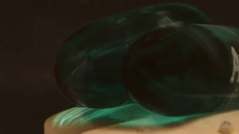 Solid and Gel Pills Dissolving Macro Stock Footage 74727343