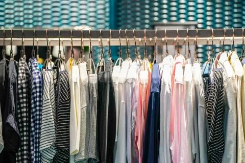 Solid and some pattern casual women's clothes hang on to green clothes line i Stock Photos
