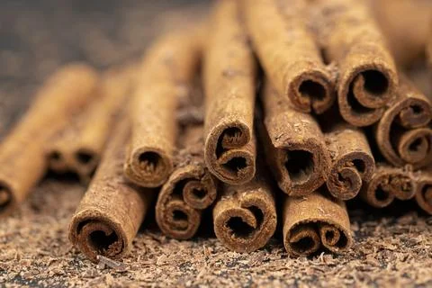 Solid aromatic cinnamon on the table in chocolate Stock Photos