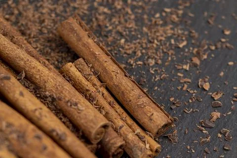 Solid aromatic cinnamon on the table in chocolate Stock Photos