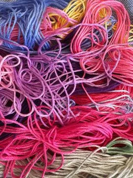 A solid background of colorful threads for cross stitch and needlework. Stock Photos