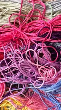 A solid background of colorful threads for cross stitch and needlework. Stock Photos