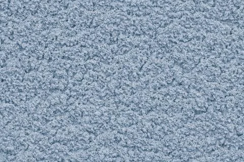 Solid background of soft pastel color with rough plaster texture. Foto stock