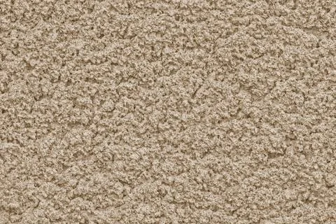 Solid background of soft pastel color with rough plaster texture. Stock Photos