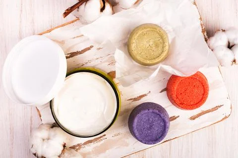 Solid bars of organic shampoo, conditioner and body cream Stock Photos