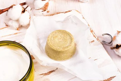 Solid bars of organic shampoo, conditioner and body cream Stock Photos