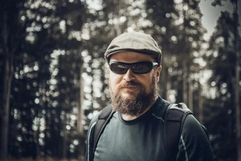 Solid bearded man in sunglasses and cap Stock Photos