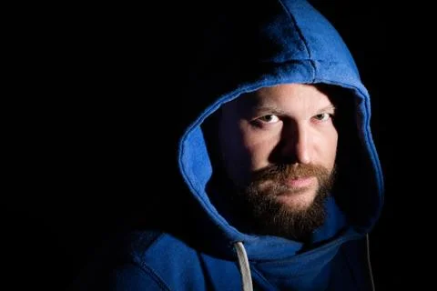 Solid bearded middle-aged man in a hood  portrai Foto stock