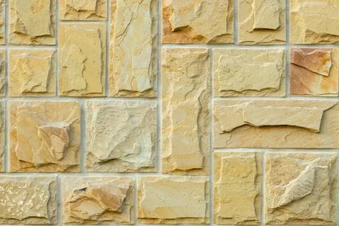 Solid beige and brown stone wall. Suitable for background Foto stock