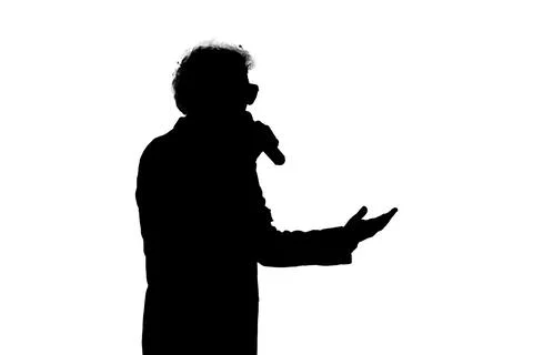 A solid black silhouette of a man speaking into a microphone and Stock Illustration