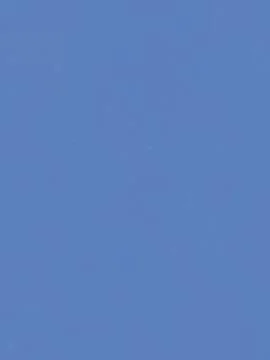 Solid blue sky texture background with fine grain. Foto stock