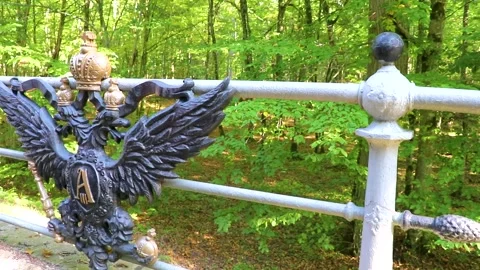 Solid bridge railing with eagle and crown National Park Belarus. Stock Footage 314892238