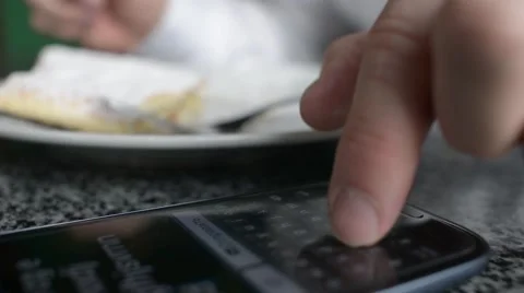 Solid business Man chating, writing sms on a Cell Mobile Phone sitting in a cafe Stock Footage 61305889