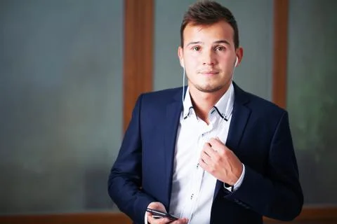Solid businessman in a jacket works in the office of the company. Stock Photos