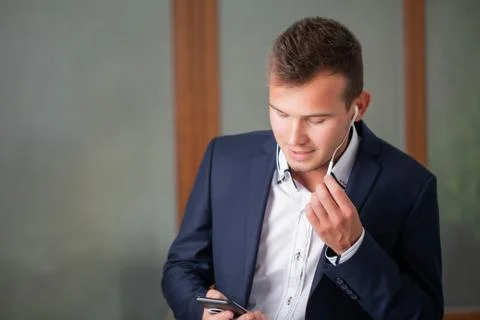 Solid businessman talking on the phone with a client in the company office Stock Photos