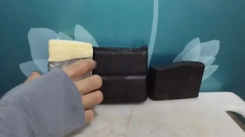 Solid Cheese and Chocolate Bars on the Table, Only the Cheese is Picked Up Stock Footage 229304075
