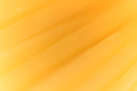 Solid cheese slices macro closeup. Background Texture. Stock Photos