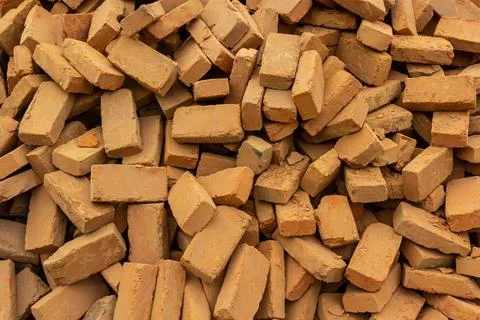 Solid clay brick used for construction. Background, brown red color Stock Photos