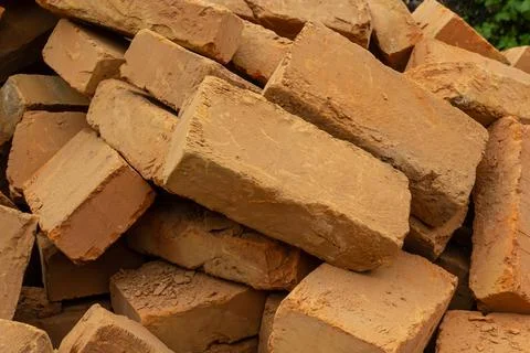Solid clay brick used for construction. Background, brown red color 写真素材