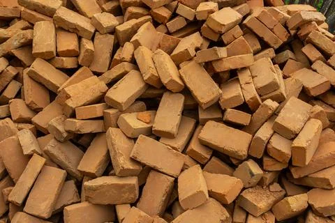 Solid clay brick used for construction. Background, brown red color 스톡 사진