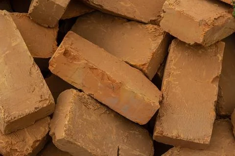 Solid clay brick used for construction. Background, brown red color 스톡 사진