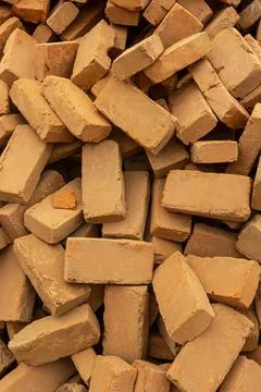 Solid clay brick used for construction. Background, brown red color 스톡 사진