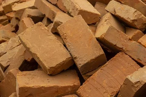 Solid clay brick used for construction. Background, brown red color Stock Photos