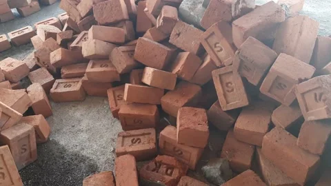 Solid clay bricks used for construction, Old red brick, Hard Laterite Stock Footage 153124285