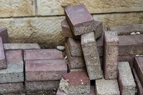 Solid clay bricks used for construction. Pile of Old bricks At Construction S Foto stock
