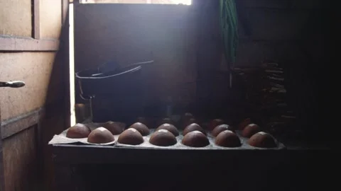 Solid coconut sugar blocks made from neera or coconut nectar sitting in rows Video stock 136134035