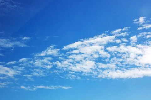 Solid color bright blue sky, background or texture Stock Photos