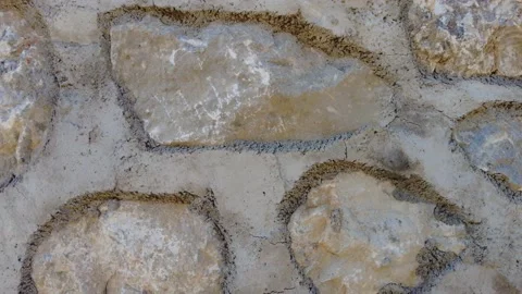 Solid concrete wall made with stones, 4K Stock Footage 165484696