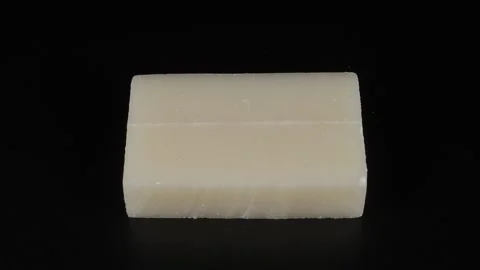 Solid cut rice cake black background Stockbeeldmateriaal 229442861