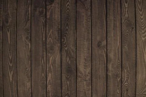 Solid dark brown wood background. background of dark wooden boards Stock Photos