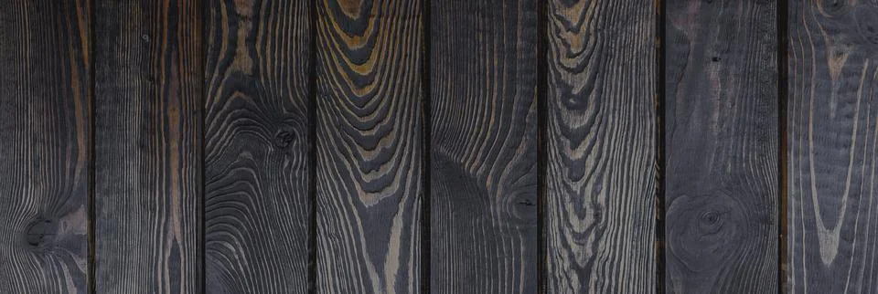Solid dark brown wood background. background of dark wooden boards Stock Photos