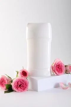 Solid deodorant and beautiful rose flowers on white background 스톡 사진