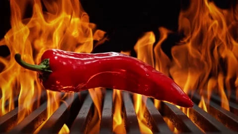 Solid fresh red chilies on a fiery grill. 4K Footage Stock Footage 232987052