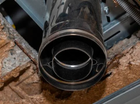 Solid fuel boiler pipe for fixing the house on the ground floor Stock Photos