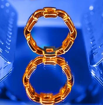Solid gold ring with a bold geometric link design Stock Photos