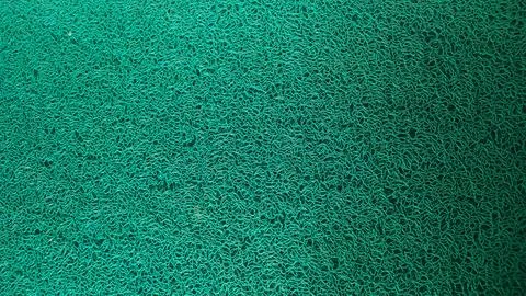 Solid green background texture of the doormat Stock Photos