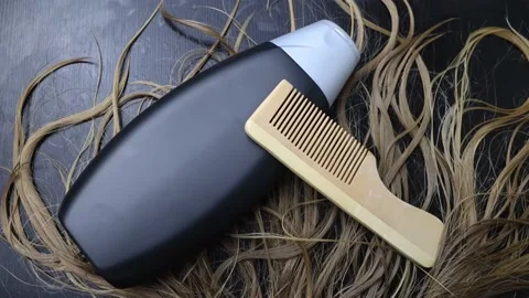 Solid hair shampoo. Composition of golden curls, soap suds, solid shampoo and co Video stock 180557932