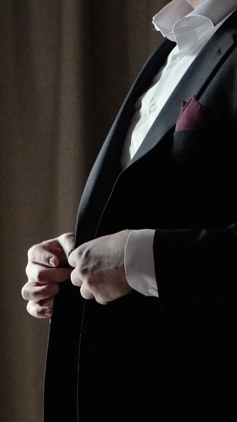 Solid handsome man groom in a business suit in the morning before his wedding Stock Footage 297187541