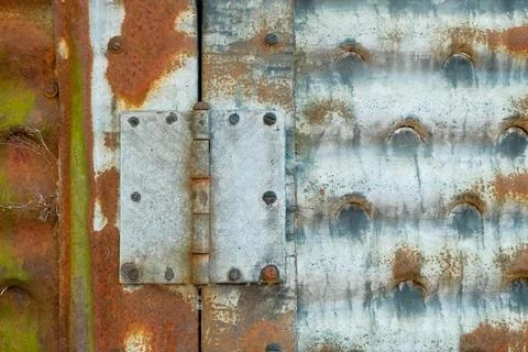Solid hinge on oxidisng, galvanised metal structure Stock Photos